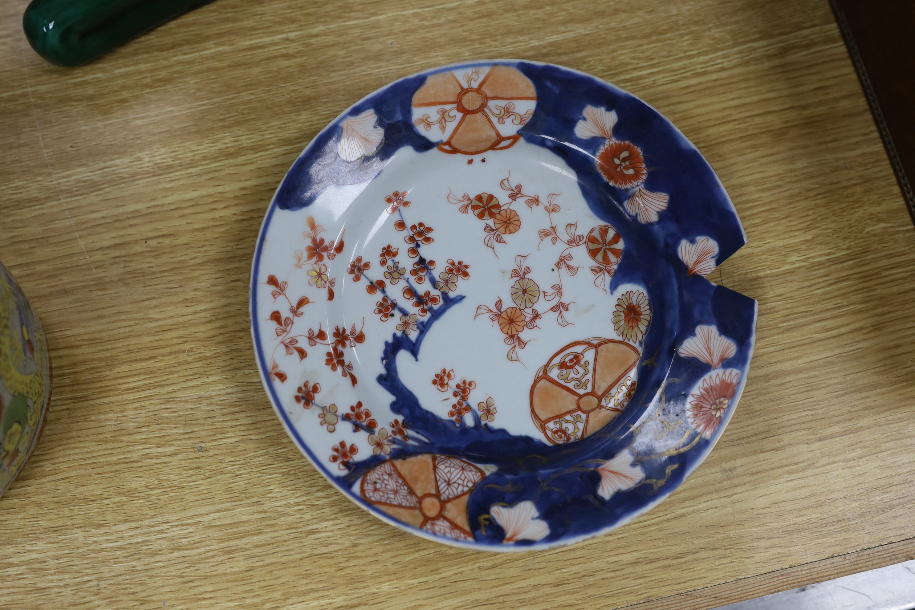 A Chinese famille rose vase, 16cm tall, together with a Japanese Imari plate and two others